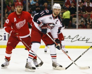 DETROIT, MI - MARCH 7:  Rick Nash #61 of the Columbus Blue Jackets skates in front of Henrik Zetterberg #40 of the Detroit Red Wings in a game on March 7, 2009 at the Joe Louis Arena in Detroit, Michigan. (Photo by Claus Andersen/Getty Images)