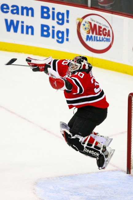 Martin Brodeur jumps up for joy after setting the all-time wins record in 2009. (File Photo)