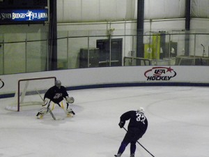 Ryan Miller takes on Dustin Byfuglien at Olympic Camp. (photo property of author)
