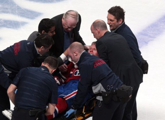 Lars Eller being carted off the ice last night at The Bell Centre. (Jean-Yves Ahern-USA TODAY Sports)