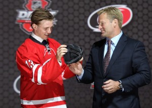 Elias Lindholm receives his team cap after being drafted 5th overall (Ed Mulholland-USA TODAY Sports)