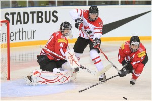 Gillian Apps (#10 CAN), Florence Schelling (#41 SUI), and Julia Marty (#6 SUI), 2011 IIHF World Championships (_becaro_/Flickr)