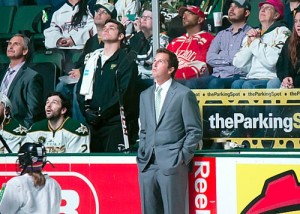 Modano watches highlights prior to dropping the puck (Ross Bonander/THW)