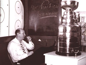 Punch Imlach, in happier times, will guide the Leafs for four more years.