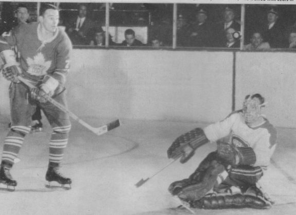 Frank Mahovlich is stopped by Charlie Hodge