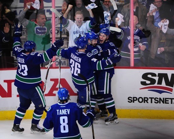 Bo Horvat celebrates with his teammates after scoring the opening goal in game one of their first-round matchup against the Calgary Flames. (Anne-Marie Sorvin-USA TODAY Sports)
