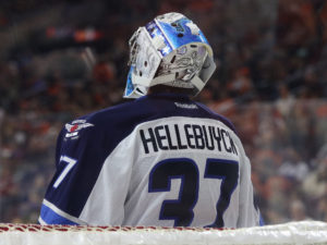 Connor Hellebuyck will look to step his game up in the New Year (Amy Irvin/ The Hockey Writers)
