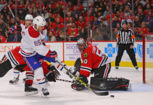 Montreal Canadiens forward Andrew Shaw and Chicago Blackhawks goalie Corey Crawford