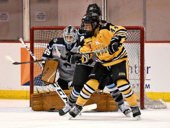 Zoe Hickel of the Boston Pride attempts to deflect a puck in front of Brianne McLaughlin of the Buffalo Beauts. (Photo Credit: Troy Parla)