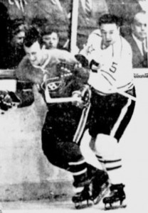 Canadiens Claude Provost is roughed up by Marcel Pronovost.
