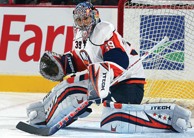 Rick DiPietro #39 of the New York Islanders, while wearing…