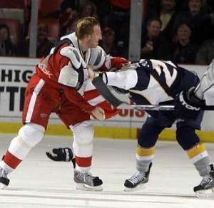 Marian Hossa and Ryan Suter drop the gloves.