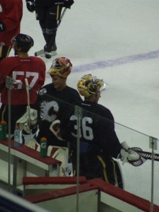 Flames goaltender Leland Irving (middle, facing) is now the #2 man in the organization. (Photo: Christopher Ralph)