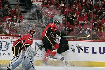 Calgary defenseman Dion Phaneuf hits Patrick Marleau of the San Jose Sharks in a dangerous way during a meeting in the 2007-08 season. (Image Credits: sharkspage)