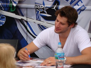 Ryan Kesler autographing posters even for the youngest of fans. (Monica McAlister)