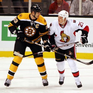 Chris Neil and former teammate Zdeno Chara enjoying some mid-game banter.