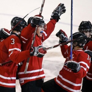 Keith Aulie and Tyler Myers celebrate a Jordan Eberle goal. Photo Courtesy Reuter Daylife, Creative Commons 