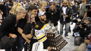 Thomas celebrated with his family and his hardware after finishing the series having allowed 8 goals in 7 games (Photo by Andrew Knoll).