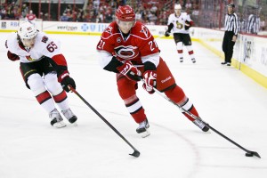 Carolina Hurricane Drayson Bowman, Ottawa Senator Erik Karlsson - Photo by Andy Martin Jr