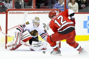 Chicago Blackhawk Corey Crawford, Carolina Hurricane Eric Staal - Photo by Andy Martin Jr