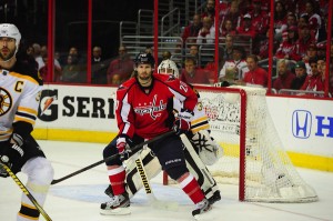 Troy Brouwer screens Tim Thomas during Game 6.