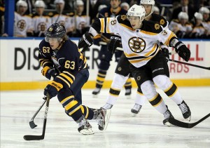 Jordan Caron of the Boston Bruins chasing Tyler Ennis (Timothy T. Ludwig-US PRESSWIRE)