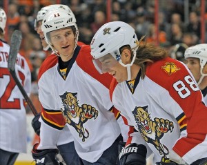 Peter Mueller (88) celebrates his goal with teammate center Jonathan Huberdeau