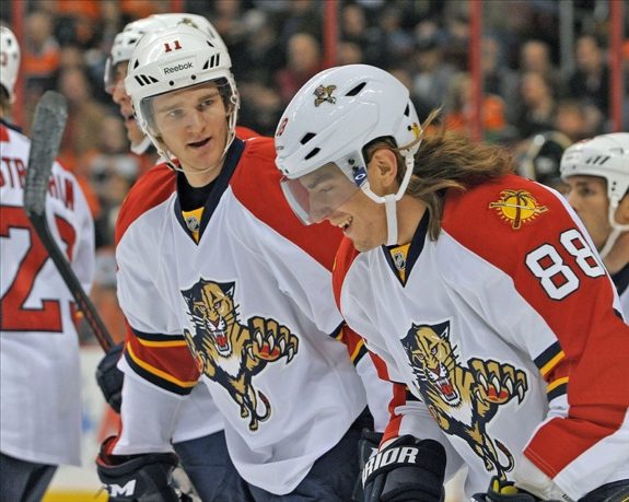 Peter Mueller (88) celebrates his goal with teammate center Jonathan Huberdeau