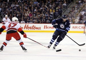Jets' Captain Andrew Ladd was left off of Team Canada's final roster for the Sochi Olympics. (Bruce Fedyck-USA TODAY Sports)