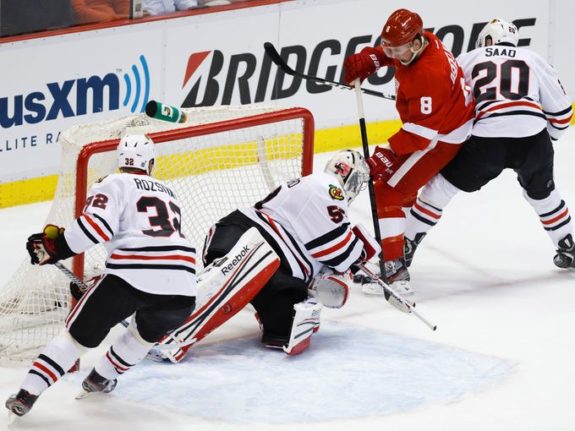 Justin Abdelkader battles Brandon Saad