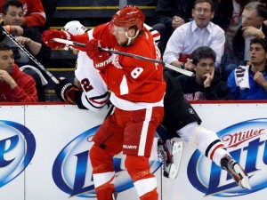 Justin Abdelkader checks Chicago Blackhawks defenseman Michal Rozsival