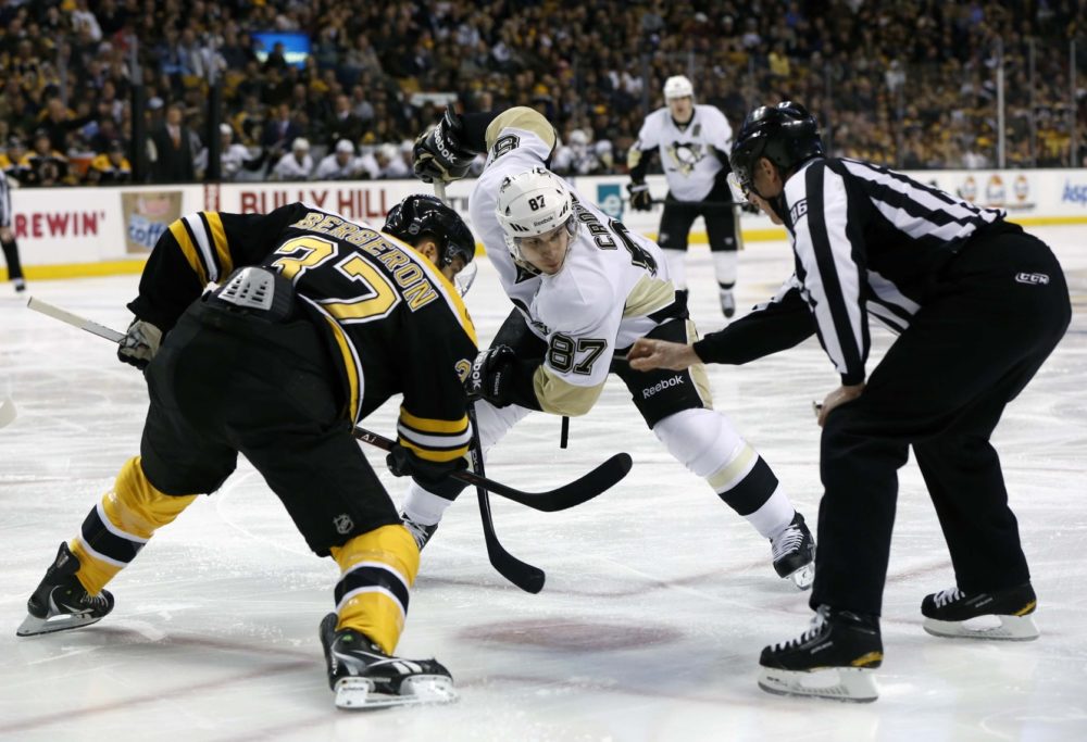 Sidney Crosby faces off against Patrice Bergeron. (Greg M. Cooper-USA TODAY Sports)