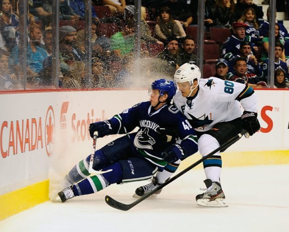 Sharks chomp Canucks