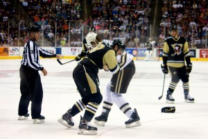 Hershey Bears' Tyson Strachan and Wilkes-Barre/Scranton Penguins' Adam Payerl trade blows in the first period. (Annie Erling Gofus/The Hockey Writers)