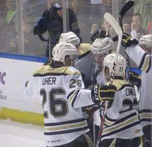 The Penguins celebrate a first-period goal in Saturday's win over Hershey. (Alison Myers/THW)