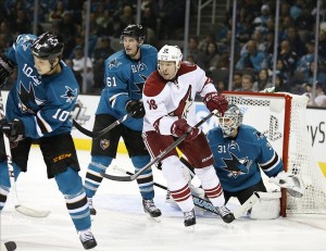 Nov 2, 2013; San Jose, CA, USA; Phoenix Coyotes left wing David Moss (18) and San Jose Sharks defenseman Justin Braun (61) in front of San Jose Sharks goalie Antti Niemi (31) during the third period at SAP Center at San Jose. Phoenix Coyotes won 3-2. Mandatory Credit: Bob Stanton-USA TODAY Sports