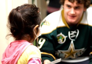 Brendan Ranford with a patient (Ross Bonander/THW)