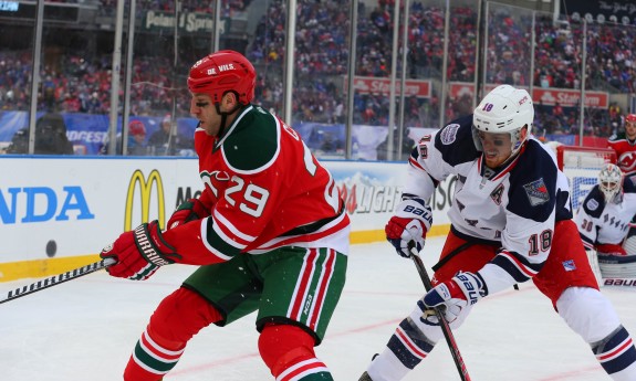 Ryane Clowe tries to make a play on the puck as Marc Staal pursues him. (Ed Mulholland-USA TODAY Sports)