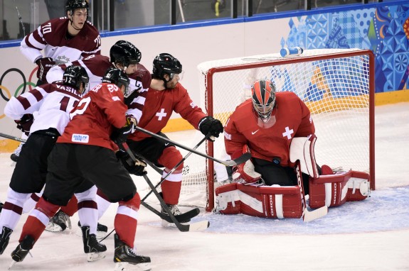 Hiller gets his first Olympic shutout aginst Latvia.
