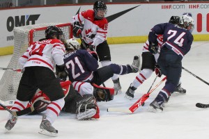 A netmouth scramble between the U.S. and Canada at the 2011 IIHF Women's World Championships. (_becaro_/Flickr)