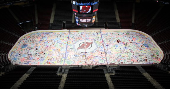 Devils and Prudential Center family and friends paint the ice. (Kerry Graue -- New Jersey Devils)