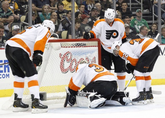 Steve Mason suffered a concussion after Jayson Megna shoved Andrew MacDonald into him in Philadelphia's 4-3 overtime win on Saturday. 