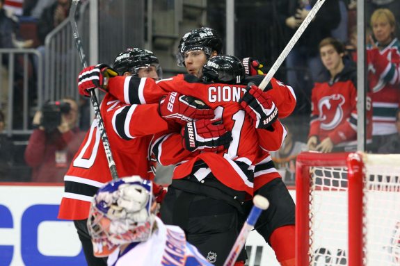 Steve Bernier (center) celebrates a goal with his CBGB linemates. (Ed Mulholland-USA TODAY Sports)