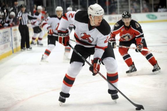 Seth Helgeson controls the puck during Albany's game against the Portland Pirates in 2013, at Times Union Center in Albany, N.Y. (Cindy Schultz / Times Union)