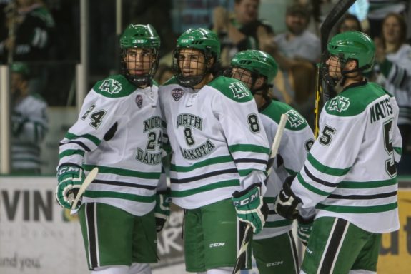 Jordan and Nick Schmaltz celebrate together 