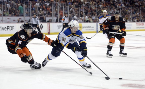 Oct 19, 2014; Anaheim, CA, USA; St. Louis Blues right wing Vladimir Tarasenko (91) reaches for the puck against Anaheim Ducks defenseman Ben Lovejoy (6) during the second period at Honda Center. (Richard Mackson-USA TODAY Sports)