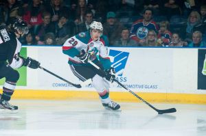 (Marissa Baecker/www.shootthebreeze.ca) An Edmonton Oilers fan looks on as Leon Draisaitl drives wide around Josh Thrower of the Vancouver Giants during his Kelowna Rockets debut, a 4-2 win at Prospera Place on Jan. 7.