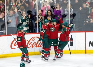 Mikko Koivu celebrates a goal with his teammates. (Brad Rempel-USA TODAY Sports)