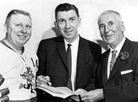 Buddy Boone, Max McNab, GM, and Fred Hume, President of the Vancouver Canucks
