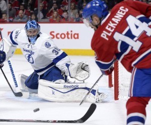 Montreal Canadiens forward Tomas Plekanec and Tampa Bay Lightning goalie Ben Bishop